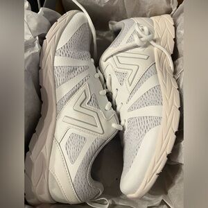 All white Vionic 335 miles shoes.